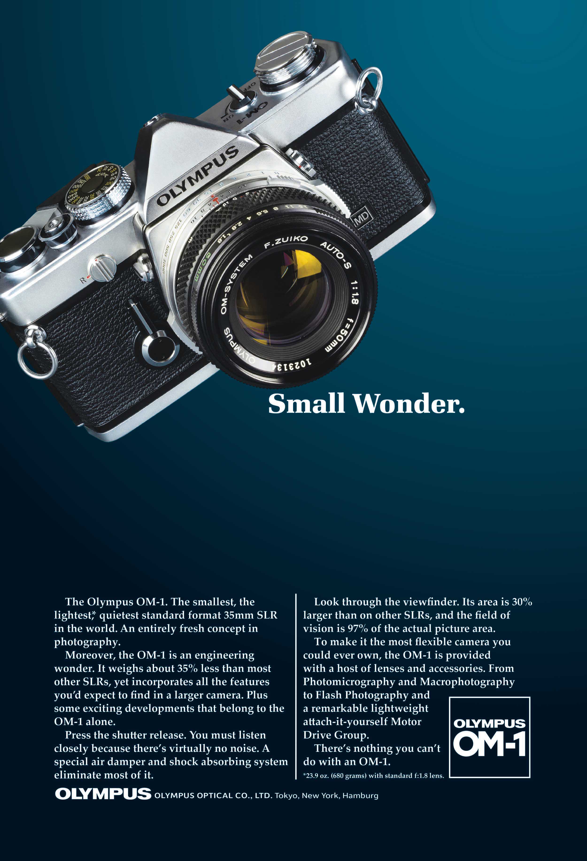 Advertisement showing the Olympus OM-1 film camera floating in front of a blue background.